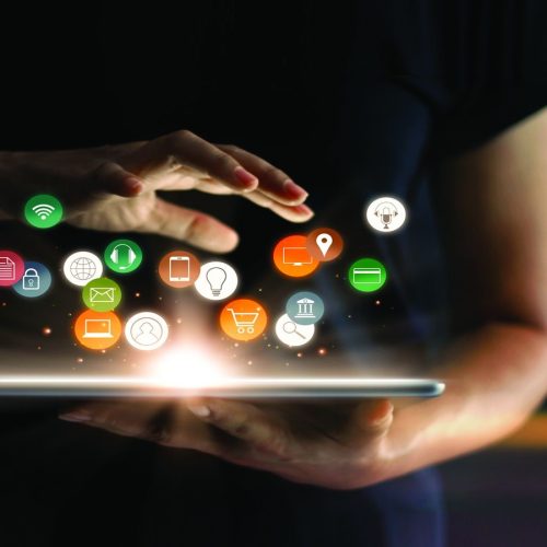 Digital online marketing commerce sale concept. Woman using tablet payments online shopping and icon customer network connection on hologram virtual screen, m-banking and omni channel.